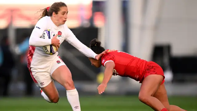 Abby Dow carries the ball for England