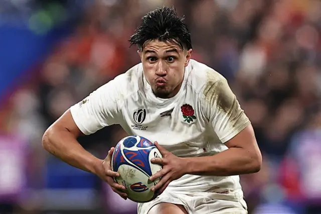 England's full-back Marcus Smith runs with the ball