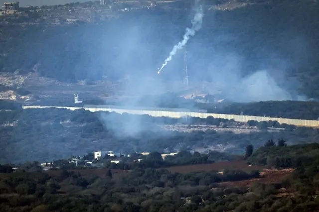 Flares are fired from northern Israel over the southern Lebanese border villages