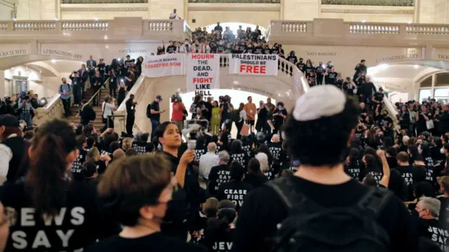 People demonstrate calling for a ceasefire amid war between Israel and Hamas, at Grand Central Station in New York City on October 27,