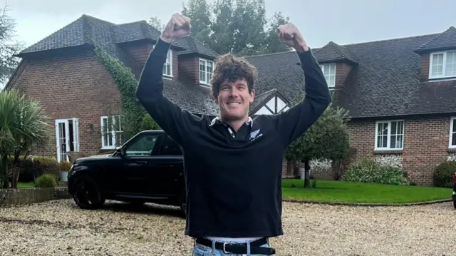 Morgan pictured with his arms aloft