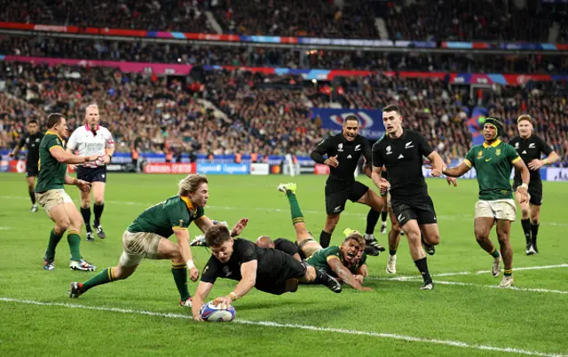 Beauden Barrett dives over the try line