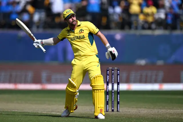 Travis Head celebrates his century