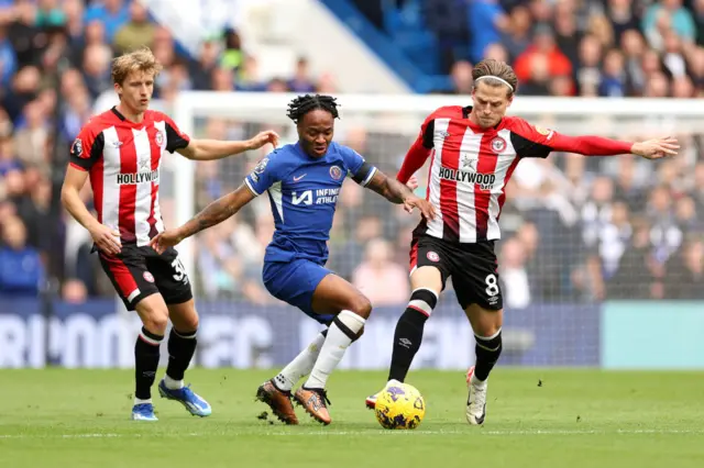 Chelsea's Raheem Sterling battling with Brentford's Mathias Jensen