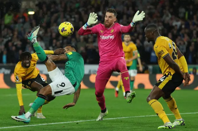 Wilson strikes an overhead kick to give Newcastle the lead.