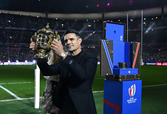 Dan Carter lifts the trophy as The Webb Ellis Cup