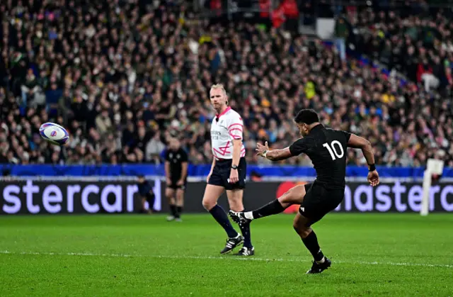 Richie Mo'unga kicks a penalty