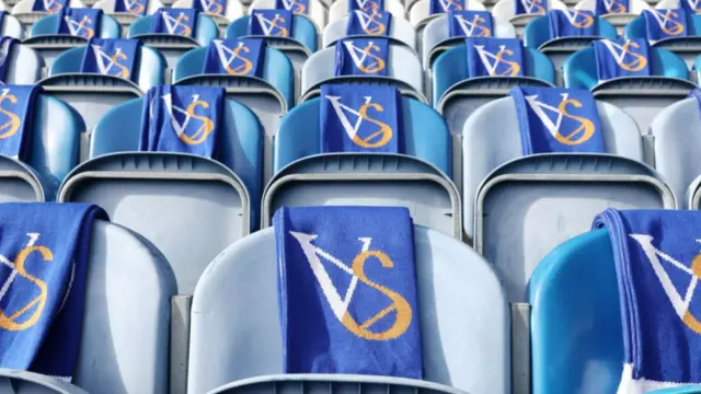 Scarves on seats at Leicester end