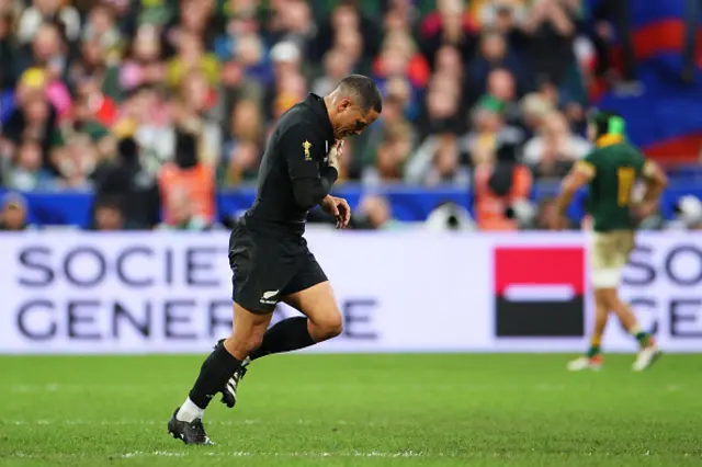 Aaron Smith jogs off the pitch