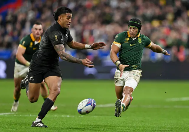 Cheslin Kolbe of South Africa kicks the ball upfield