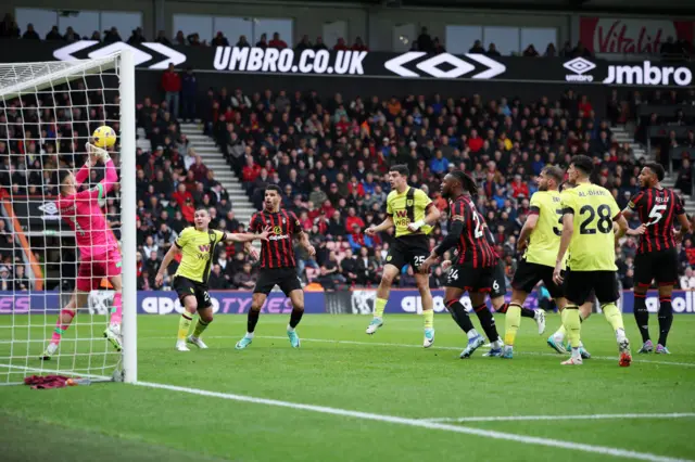 Burnley's James Trafford saves shot from Chris Mepham