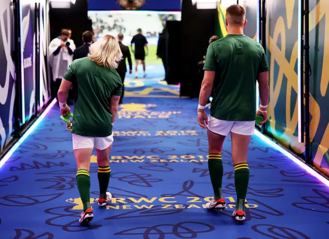 Handre Pollard and Faf de Klerk walk out the tunnel