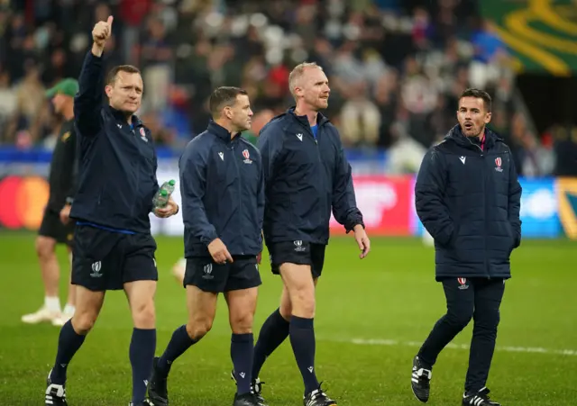 Referee Wayne Barnes (second right)