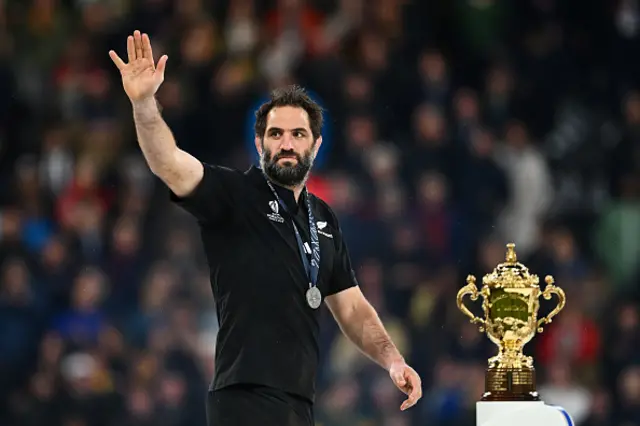 Sam Whitelock walks past the Web Ellis Cup