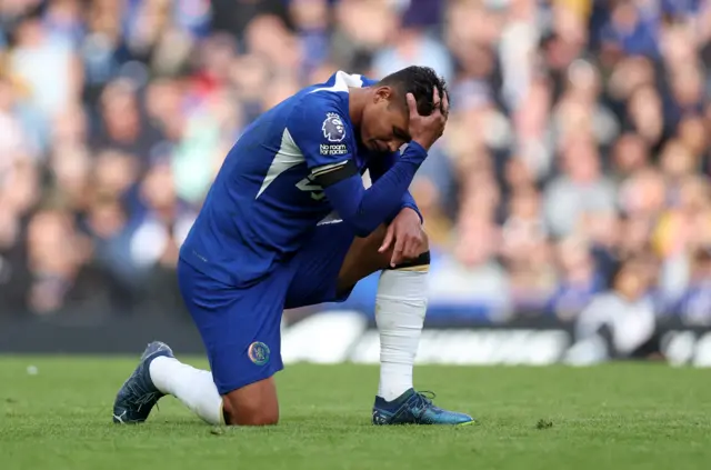 Chelsea's Thiago Silva kneeling in frustration as Chelsea struggle for goals