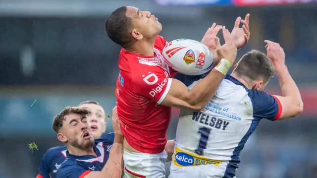 England and Tonga contest a high ball