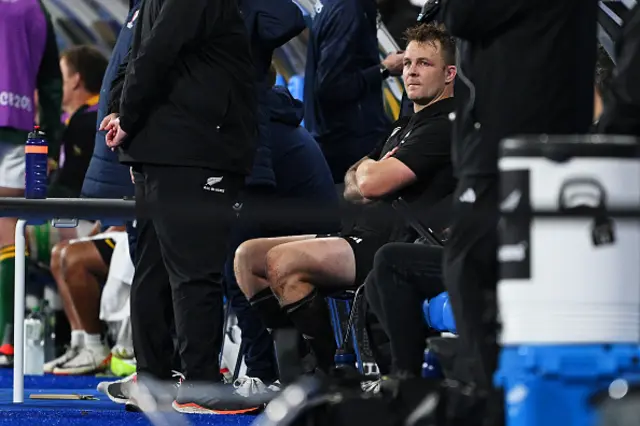 Sam Cane sits on the bench after his red card