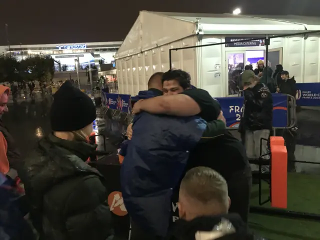 Fans hug