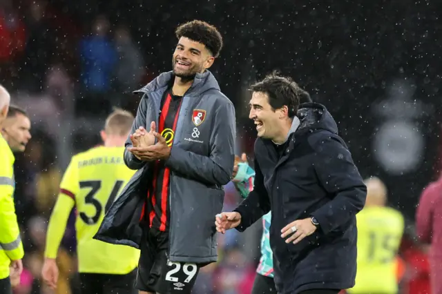 Billing and Iraola share a laugh on the pitch at full time.