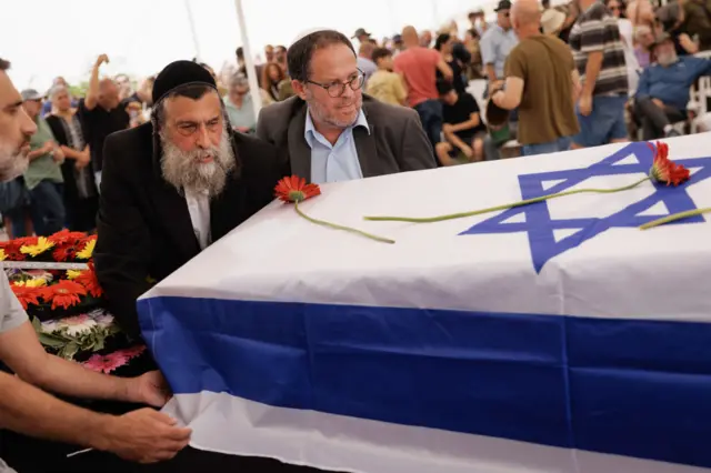 Mourners attend the funeral of Yonat Or, at Palmachim cemetery on October 29, 2023 in Kibbutz Palmachin, Israel