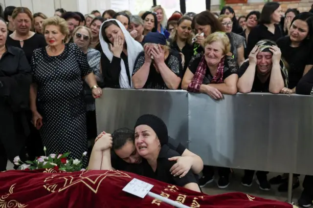 Manna mourns her daughter, Tamar Chaya Torpiashvili, a 9-year-old girl who died days after experiencing a cardiac attack during a siren warning of incoming rockets being fired from Gaza into Israel