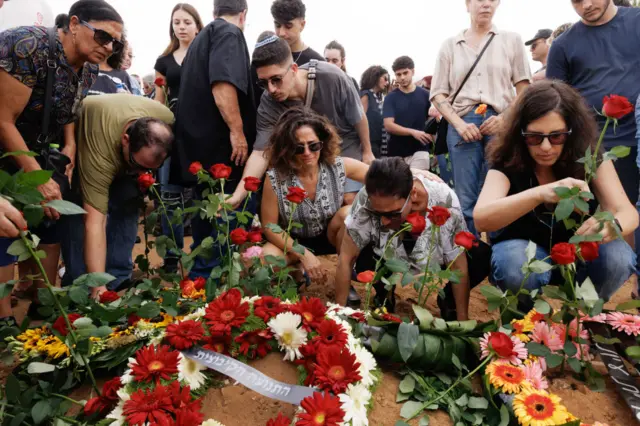 Mourners attend the funeral of Yonat Or, at Palmachim cemetery on October 29, 2023 in Kibbutz Palmachin, Israel