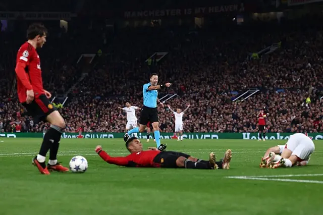 Referee Ivan Kruzliak points to the spot as he awards a penalty to Galatasaray