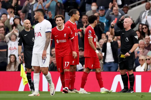 Curtis Jones (centre) is sent off