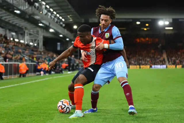 Chiedozie Ogbene and Luca Koleosho of Burnley battle for the ball