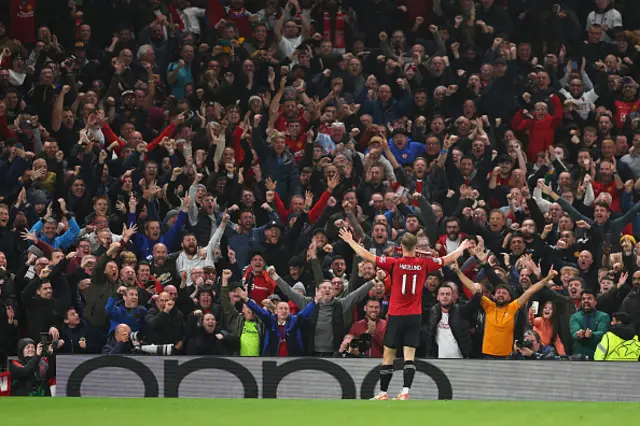 Rasmus Hojlund of Manchester United celebrates in front of fans