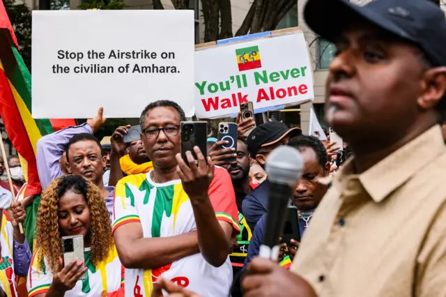 Journalist Habtamu Ayalew Teshome speaks to the crowd as members of the Washington DC Ethiopian community demonstrate outside of the U.S. State Department to protest attacks by the Ethiopian government on ethnic Amharas and the Amhara region in Ethiopia on August 10, 2023, i