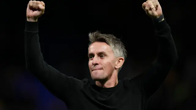 Ipswich Town manager Kieran McKenna salutes the crowd after a match