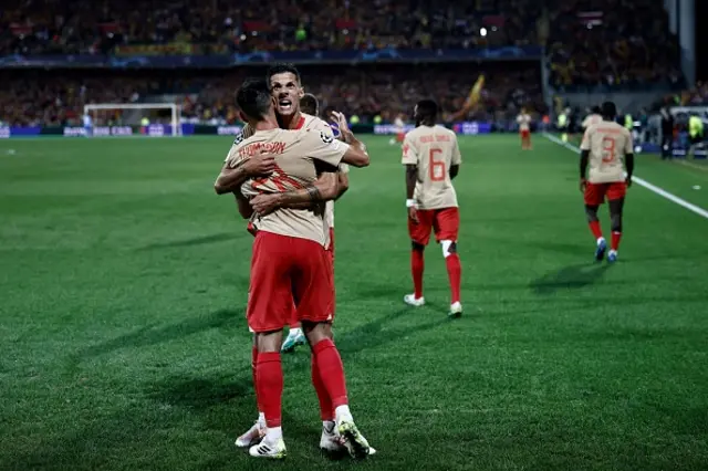 Adrien Thomasson celebrates with a teammate after scoring