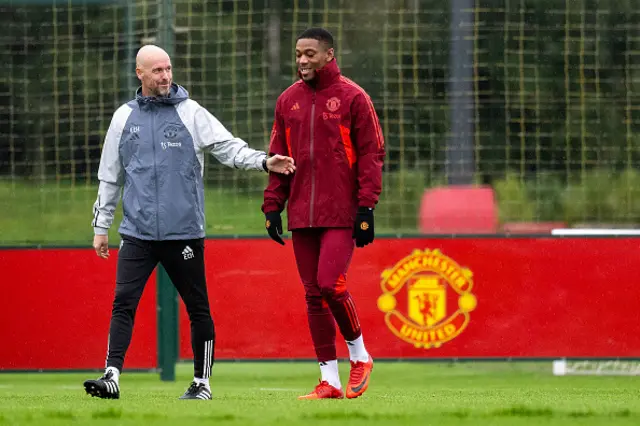 Anthony Martial and Manager Erik ten Hag of Manchester United speak during training