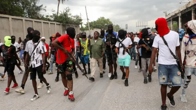 Former police officer Jimmy "Barbecue" Cherizier, leader of the 'G9' coalition, leads a march surrounded by his security against Haiti's Prime Minister Ariel Henry, in Port-au-Prince, Haiti September 19, 2023.