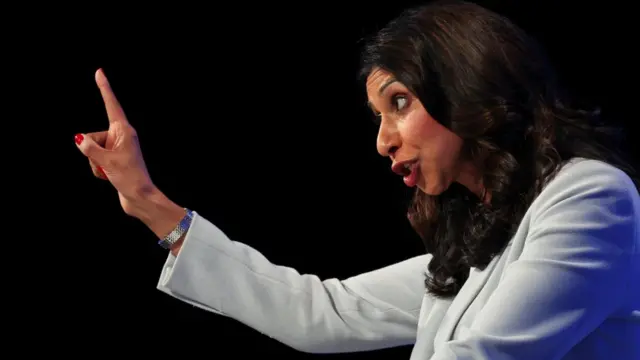 Home Secretary Suella Braverman gestures as she speaks at Britain's Conservative Party's annual conference