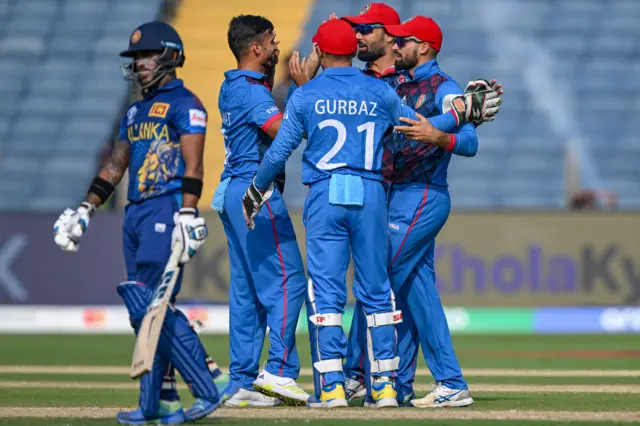 Afghanistan celebrate the wicket of Pathum Nissanka