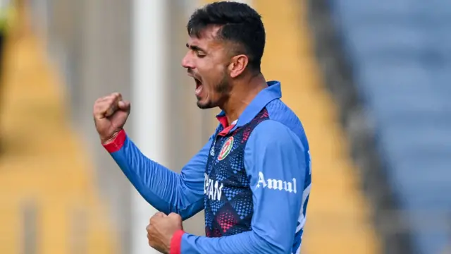 Mujeeb Ur Rahman celebrates the wicket of Kusal Mendis