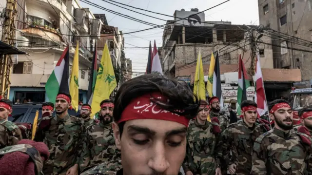 Hezbollah fighters at a funeral for a comrade killed by Israel earlier this month