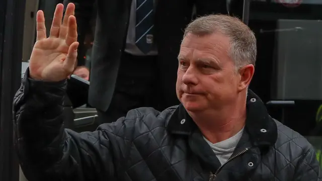 Mark Robins waving