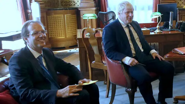 Former PM Boris Johnson with his principal private secretary Martin Reynolds sitting together smiling