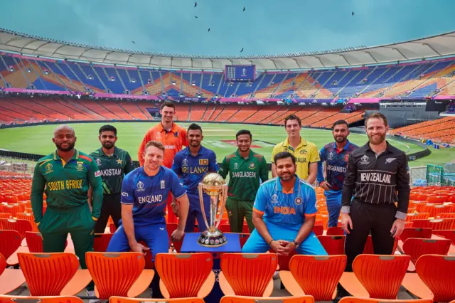 Captains of all 10 teams and the World Cup trophy