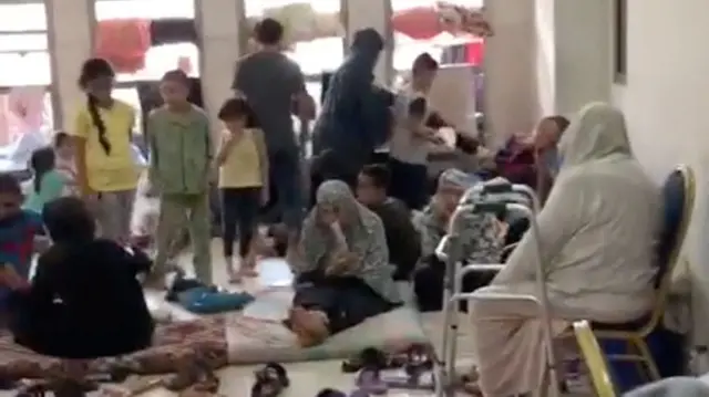 People are pictured inside Al-Quds Hospital, as the conflict between Israel and the Palestinian Islamist group Hamas continues, in Gaza City, in this still image from a video released October 29, 2023. Palestine Red Crescent Society/via REUTERS THIS IMAGE HAS BEEN SUPPLIED BY A THIRD PARTY. NO RESALES. NO ARCHIVES. MANDATORY CREDIT. REUTERS WAS NOT ABLE TO INDEPENDENTLY VERIFY WHEN THE FOOTAGE WAS FILMED.