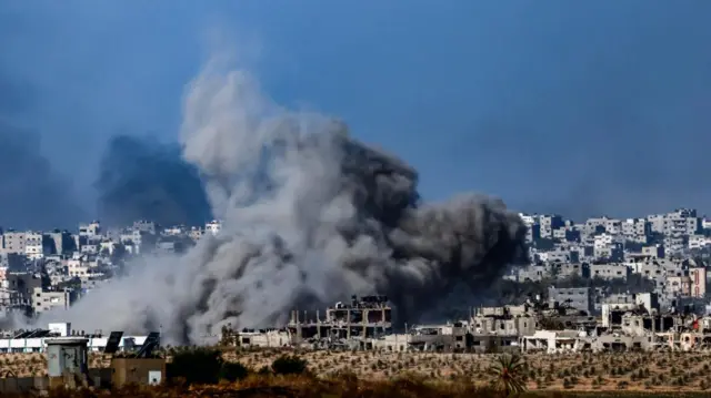 Smoke billows from the northern part of the Gaza Strip as a result of an Israeli airstrike, as seen from Sderot, southern Israel, 30 October 2023.