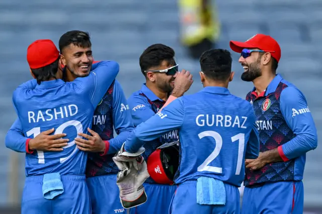 Mujeeb celebrates a wicket