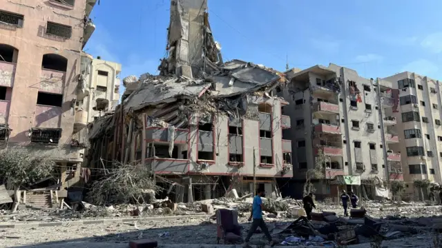 Damaged residential buildings are seen in the aftermath of Israeli strikes, near Al-Quds hospital in Gaza City October 30, 2023.