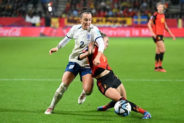 Lucy Bronze is tackled by Tessa Wullaert