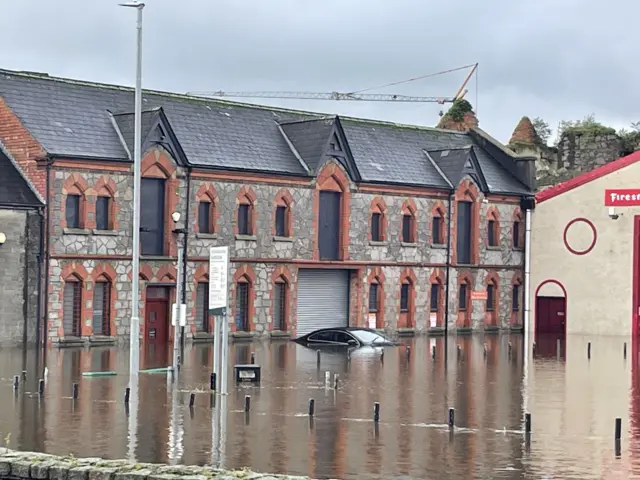 Basin Walk in Newry where a car is almost totally submerged in flood water