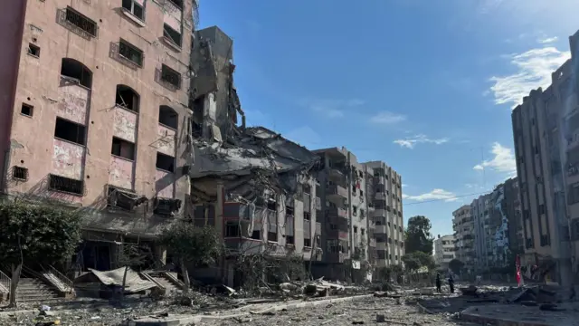 Damaged buildings are seen in the aftermath of Israeli strikes, near Al-Quds hospital in Gaza City