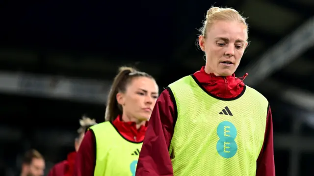 Jess Fishlock leads her side out in the warm-up